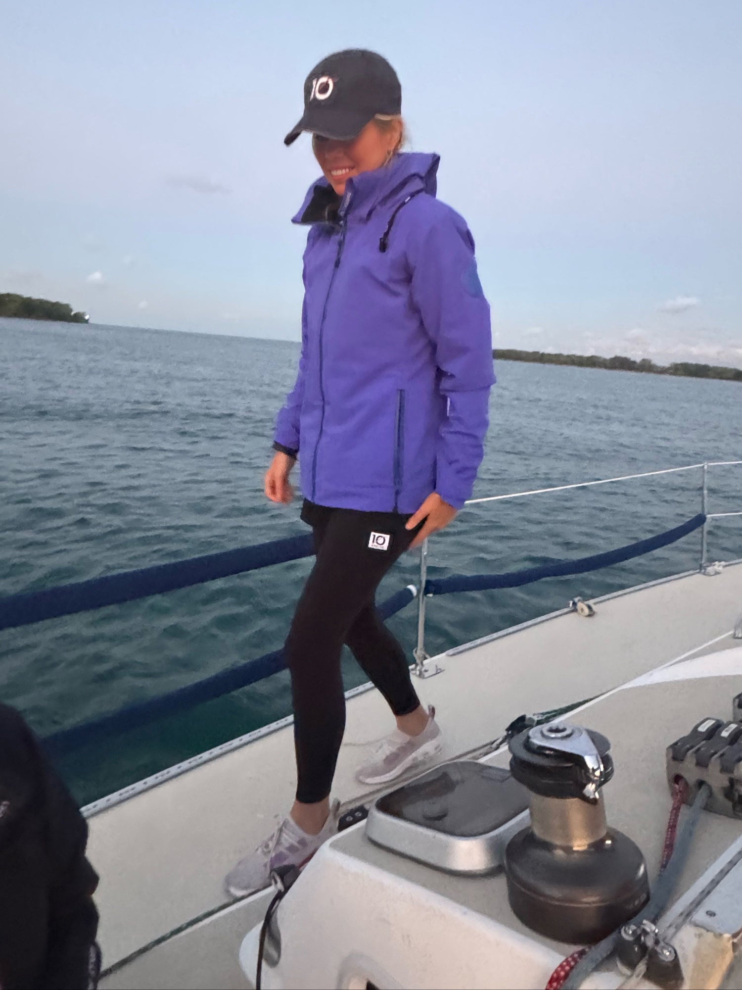 Sailor in Somand Farallon Sailing Jacket and 10 Knots Great Lakes Hat and 10 Knots Shorts
